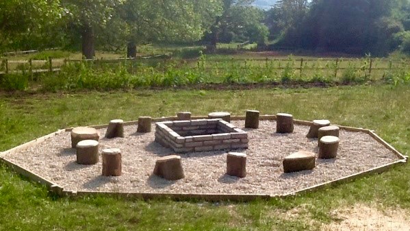 Outdoor learning log circle and fire pit